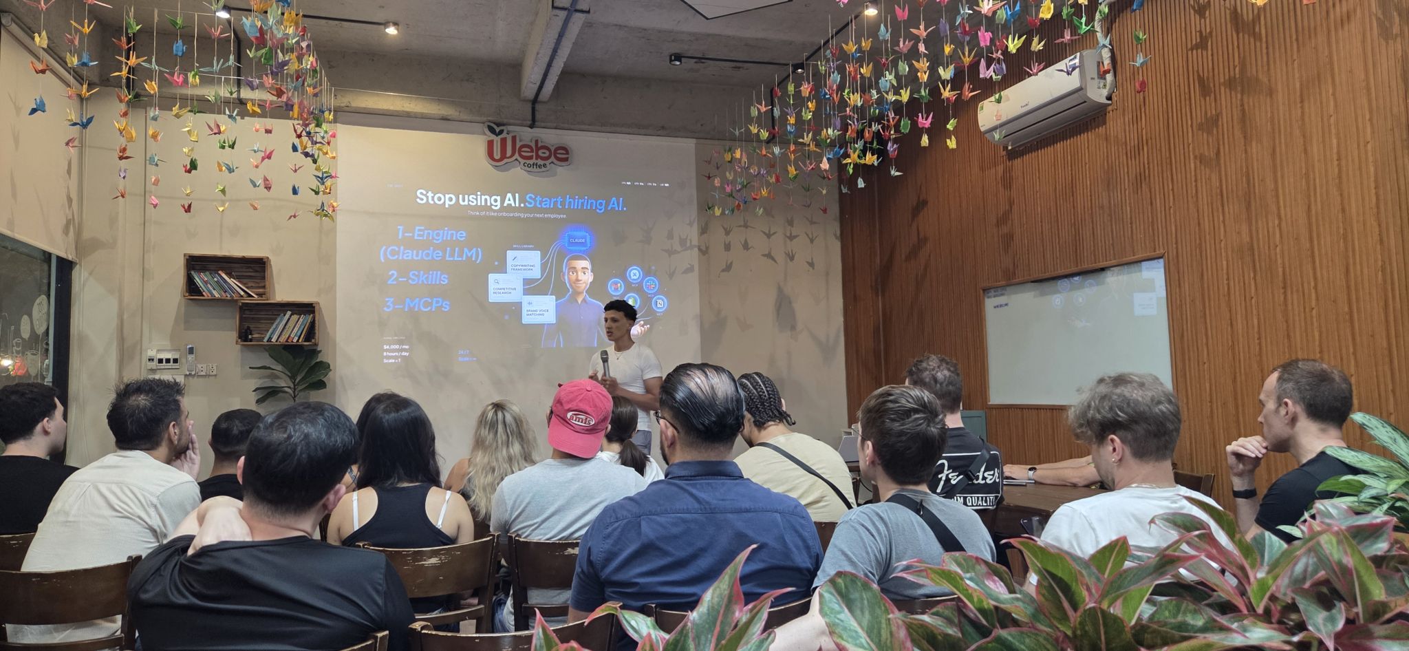 Naoufal Chiguer speaking on AI implementation at an AI event in Da Nang